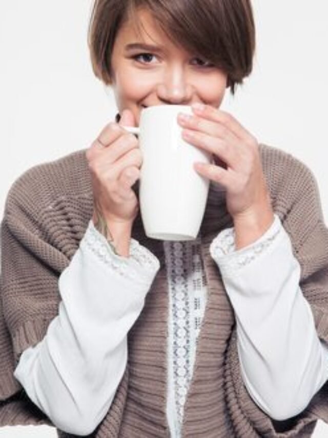 photodune-14209986-pretty-smiling-young-woman-in-knitted-jacket-drinking-tea-xs-365x330